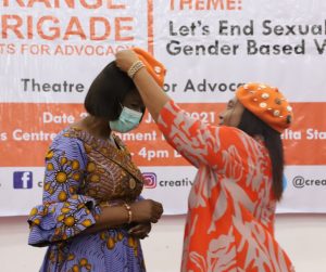 Wife of Delta Governor, Dame Edith Okowa (left) being decorated as Squardron Leader, Orange Brigade, by ace Actress and Co-founder, Orange Brigade, Hilda Dokubo, during the formal inauguration of Orange Brigade for Advocacy Against Sexual and Gender-Based Violence held in Asaba for adolescents in the State on Monday