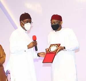  SAMUEL Pix3068: Delta Governor, Senator Dr. Ifeanyi Okowa (left) presenting a "Life Time Achievement Award" to the Chairman, UBA, Mr. Tony Elumelu,represented by his brother, and member representing Aniocha/ Oshimili Federal Constituency in the Federal House of Representatives, Rt. Hon. Ndudi Elumelu at the Award/Gala Night organised by Delta government to conclude activities for the 30th anniversary celebration of the creation of the State in Asaba on Friday
