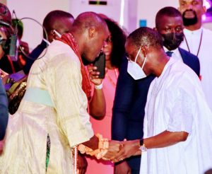 Delta Governor ,Senator (Dr) Ifeanyi Okowa (right),exchanging pleasantries with His Royal Majesty ,Ogiame Atuatse lll, Olu of Warri at the Olu's coronation Thanksgiving Service at the Olu's palace in Warri. Sunday.