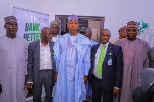 Governor Babagana Zulum commends Unity Bank before cutting the tape during the official commissioning of a building donated to Borno SUBEB by Unity Bank Plc.  
