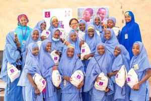 L—R: Halima Baba shehu, Noella Ibeme and Hadiza Lawan Bukar with students of Government Girls College (GGC), Maiduguri posing with their kits.