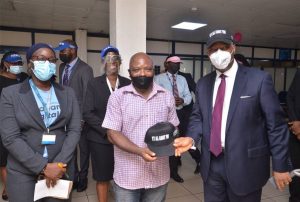 Managing Director/Regional Executive, Ecobank Nigeria Patrick Akinwuntan after attending to Mr. Titus Ofurum, Managing Director, Marigold Farming Tools  